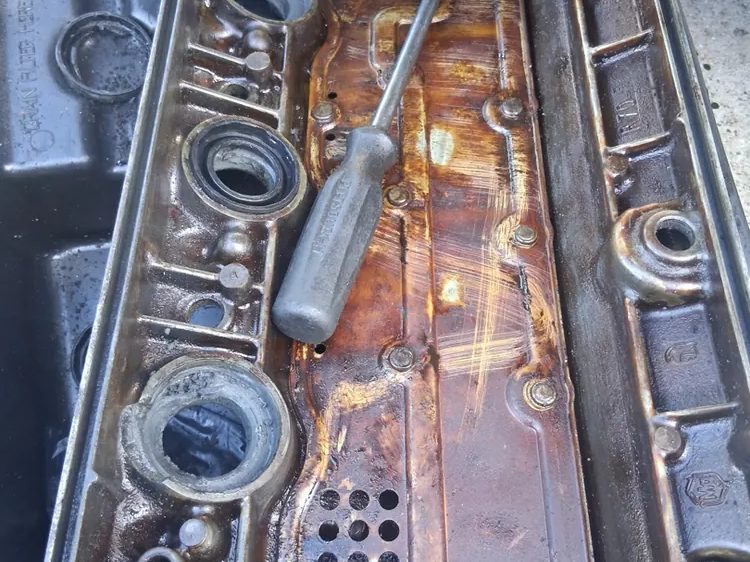 Sludge and varnish inside an engine valve cover