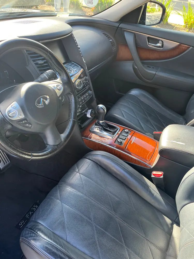 The front seats, dash and windshield of an SUV