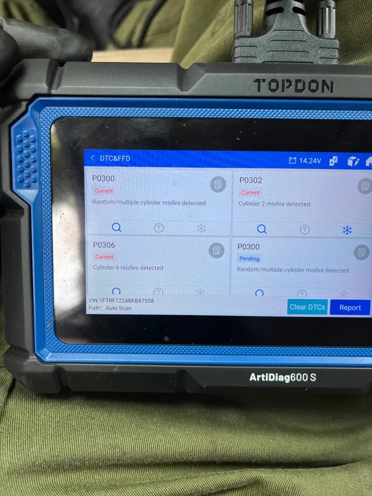 A scan tablet listing several misfire codes at once