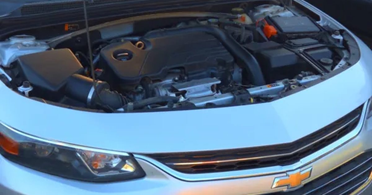 A mechanic near me street call, a Chevrolet sedan with its hood up in Jurupa Valley