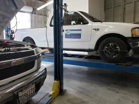 "RC EMPIRE" Alignment, Collision & Auto Service in Orange